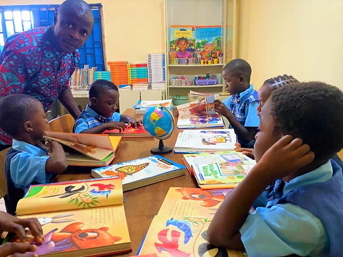 Children reading books at Damiefa School